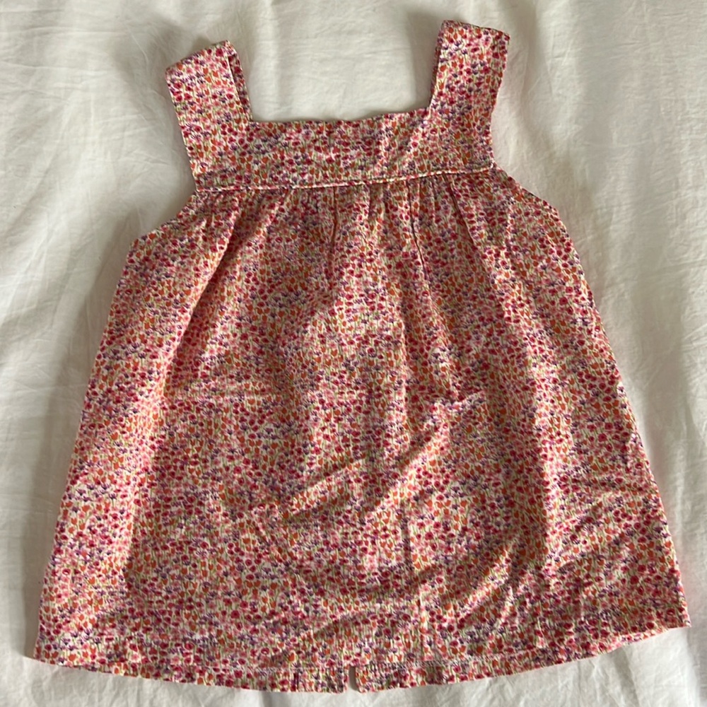 Floral tank with button back.